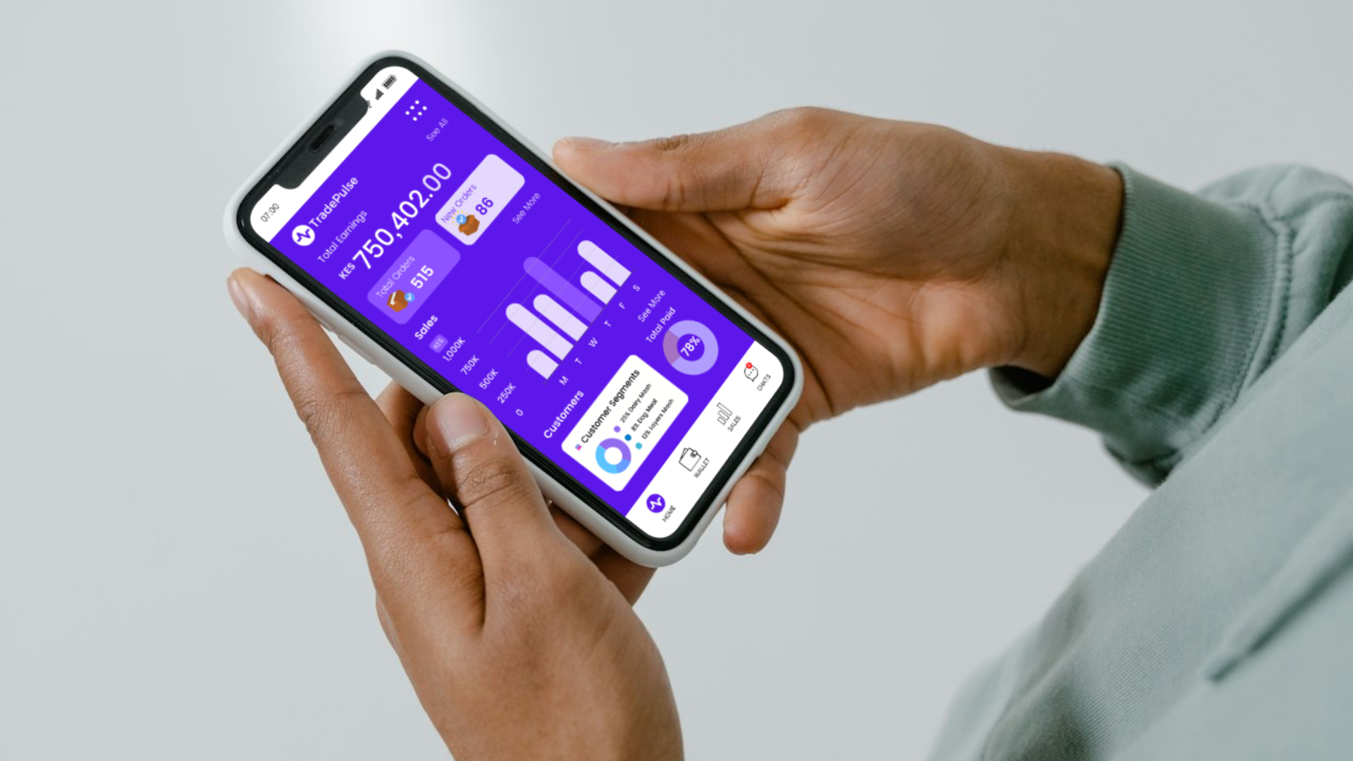 Hands holding a phone showing the TradePulse mobile app dashboard