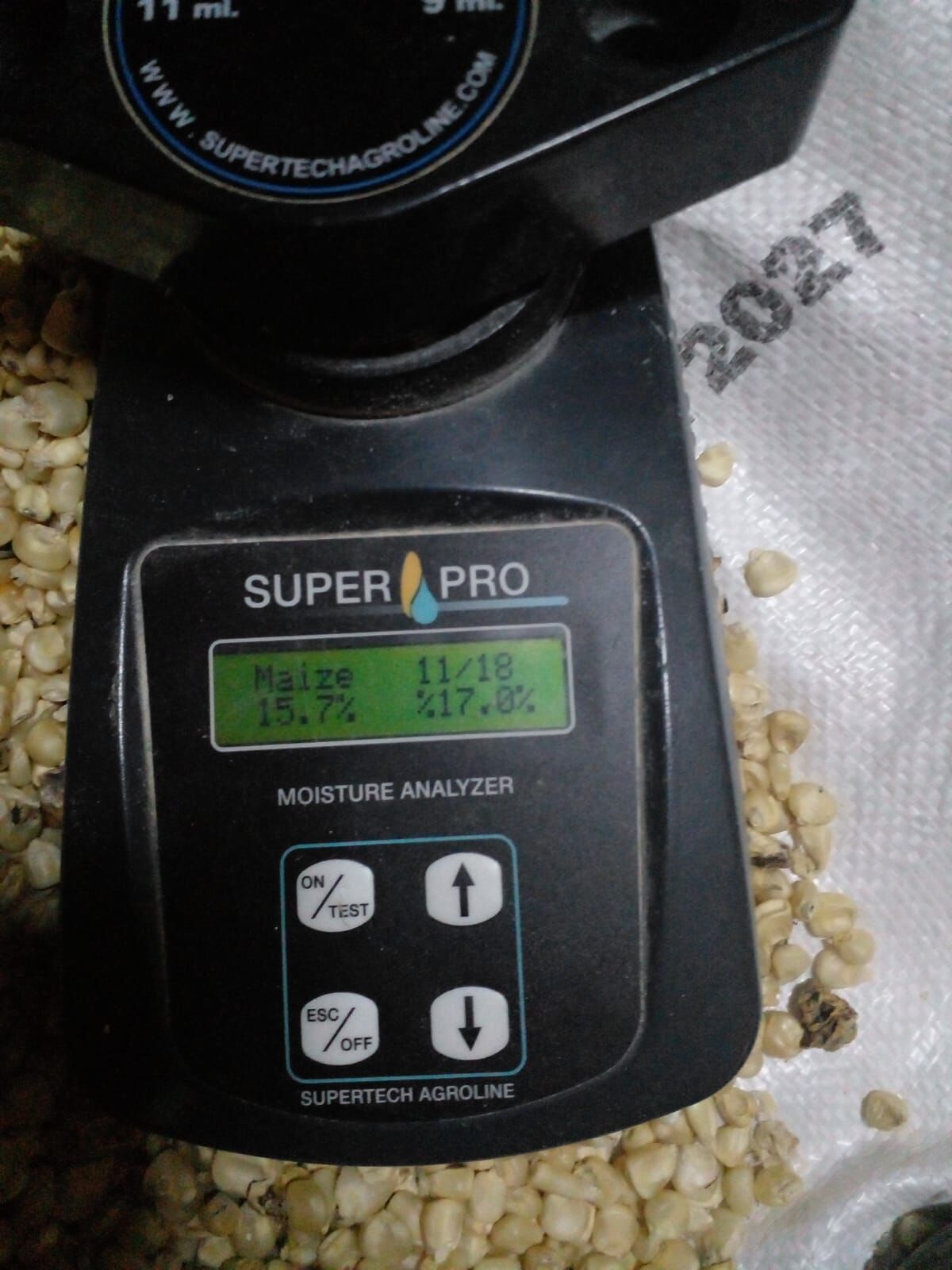 A moisture analyser reading a maize sample during a quality check